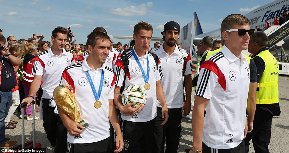 Cool: Miroslav Klose, Lahm, Lars Bender, Khedira and Toni Kroos with the cup and ball as the German  team return