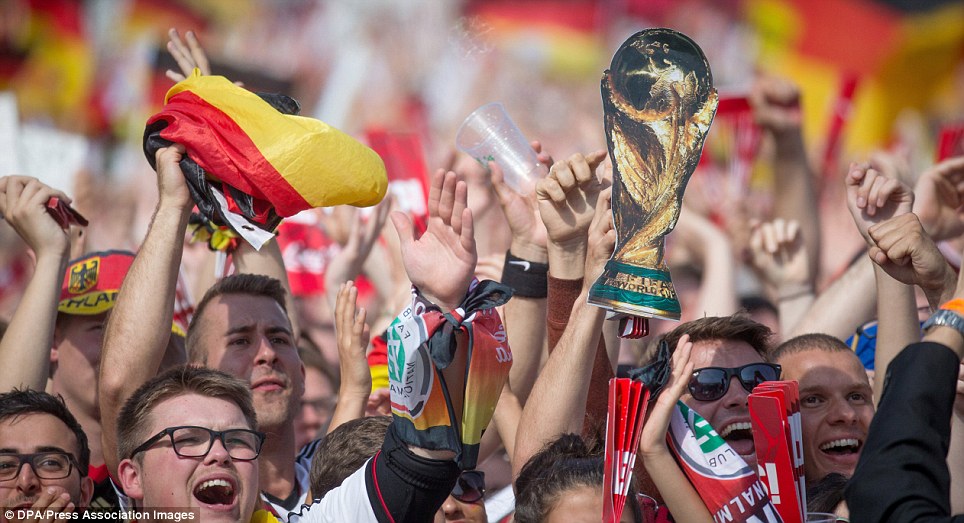 Germany fans chant and cheer as their heroes arrive