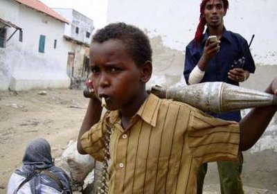 somali-child-holds-ammunition-as-fighter