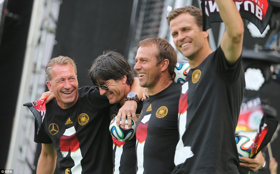 All smiles: Coaching staff Andreas Koepke (left to right), Low, assistant coach Hansi Flick and team manager Oliver Bierhoff