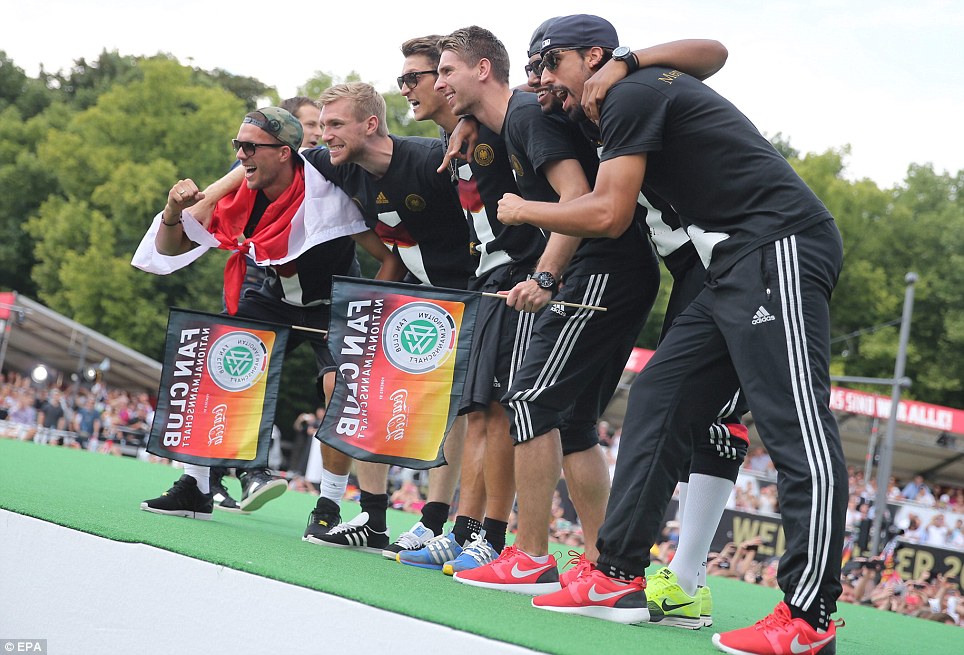 Pleased: Lukas Podolski (left to right), Per Mertesacker, Mesut Ozil,  Ron-Robert Zieler, Jerome Boateng and Sami Khedira on stage