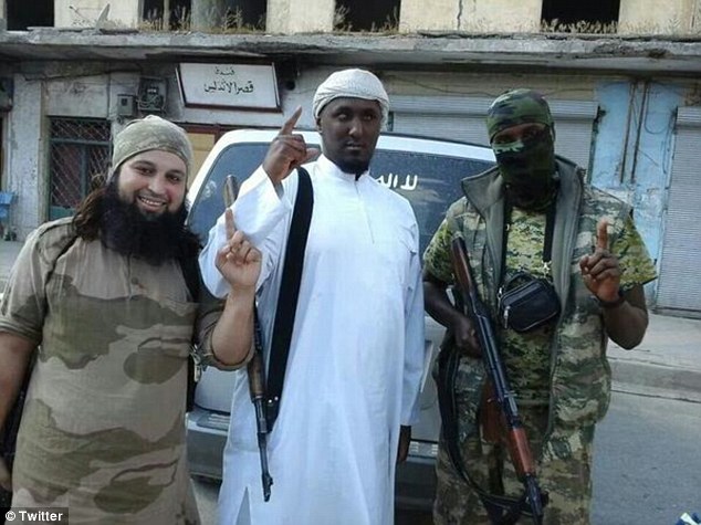 Militant: Numerous images of Taymullah al-Somali (centre) have emerged, including this one showing him posing alongside two men from Belgium. The man on the left is reportedly named Hicham Chaib