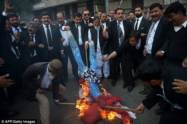 In Pakistan, lawyers burned an effigy of French president Francois Hollande, who today said those taking part in the protests 'did not understand our attachment to freedom of speech'