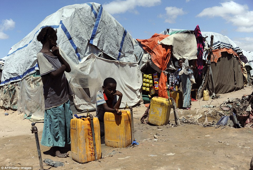 Somali refugees go about their daily lives on October 30, 2014, at the Sayyid camp south of Mogadishu. UN chief Ban Ki-moon warned  that Somalia risks returning to famine without urgent aid