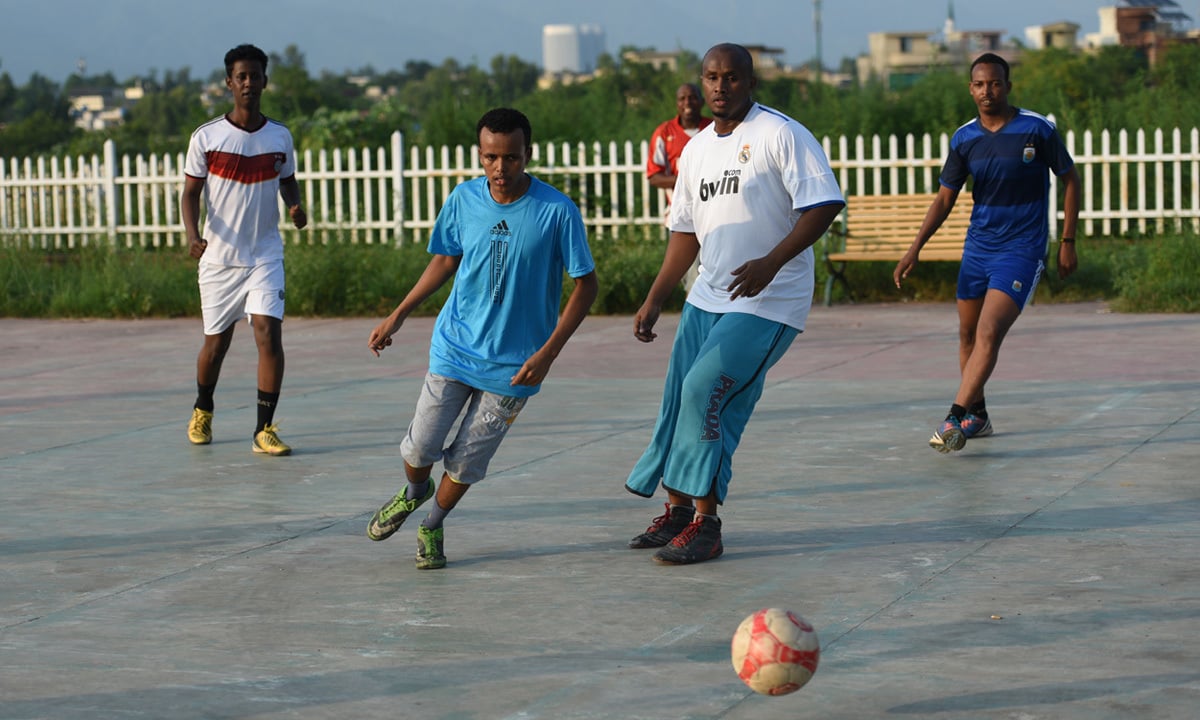 Somali refugees playing football in a community ground | Tanveer Shahzad, White Star