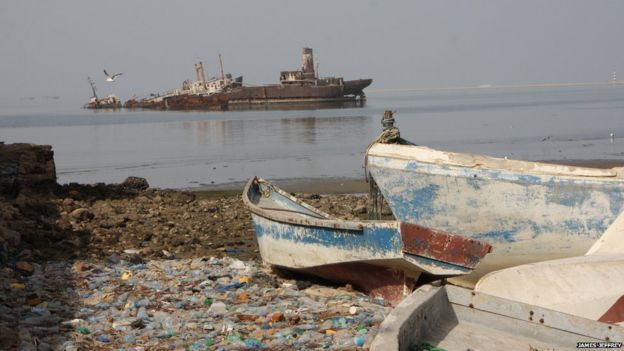 Berbera's fishing harbour is strewn with refuse and dilapidated boats and half-sunken ships are further out in the bay