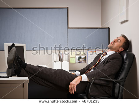 stock-photo-businessman-sleeping-at-desk
