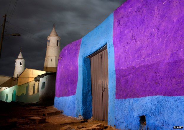 Brightly coloured wall and mosque in Harar