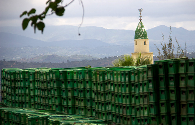 Beer crates in the foreground, a mosque in the background