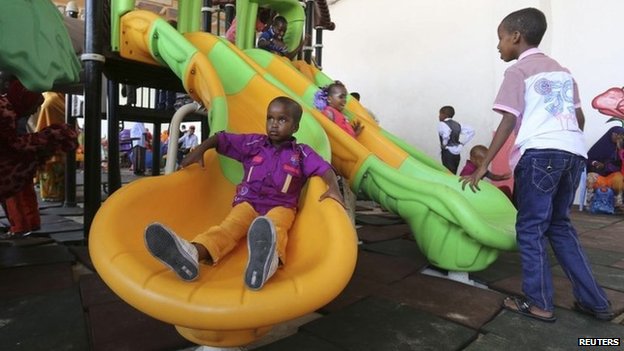 Children play in celebration after attending Eid al-Fitr prayers to mark the end of the fasting month of Ramadan in Somalia"s capital Mogadishu, July 28, 2014.