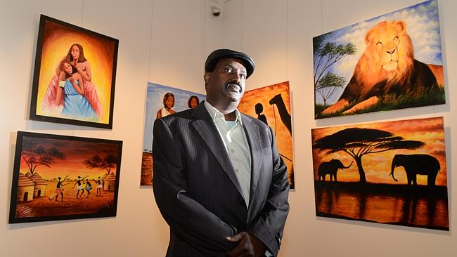 Somali artist Abdulqadir Barre with some of his work from the exhibition at the Kingston
