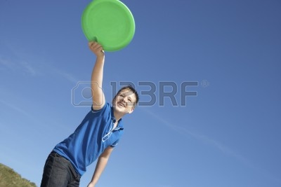 10362654-boy-playing-frisbee-on-beach.jp