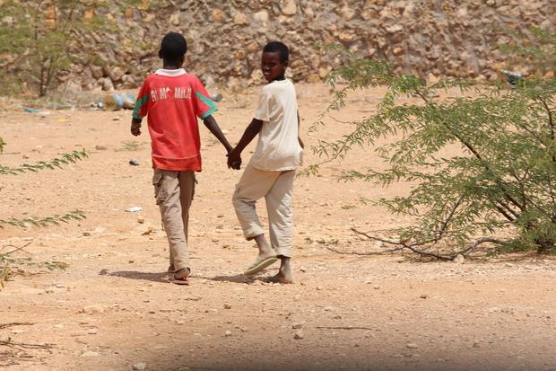 Boys walking back home after chores near the Djibouti AMISOM base in Belet-Weyne  Somalia.