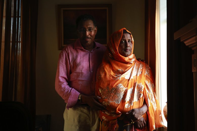 Abdulkadir Aden Mohamud, also known as "Jangeli," and his wife Hamdi Abdulle, executive director of the Somali Youth & Family Club, are photographed in their home in Renton. Mohamud worked as the head of Somalia's development bank in the 1980s.