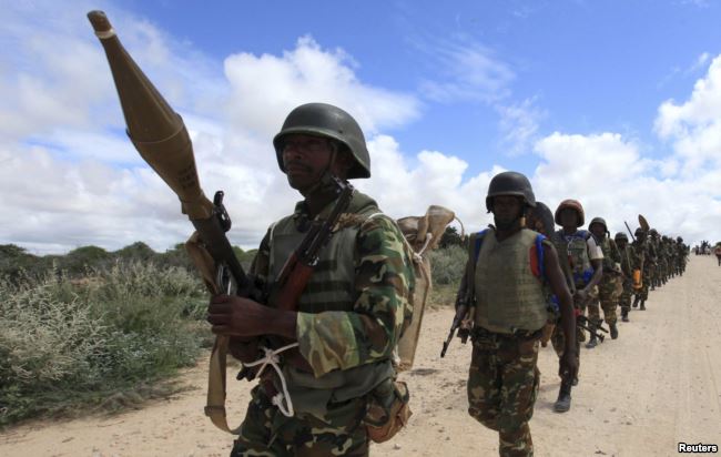 FILE - African Union Mission in Somalia (AMISOM) soldiers from Burundi patrol on the outskirts of Mogadishu, Somalia, May 22, 2012.