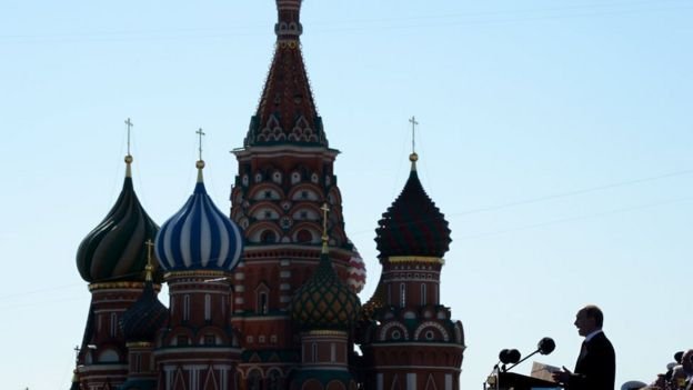 Russia's President Vladimir Putin speaks at Red Square in Moscow, on May 9, 2014, during a Victory Day parade. Thousands of Russian troops marched in Red Square to mark 69 years since victory in World War II, in a show of military might amid tensions in Ukraine following Moscow's annexation of Crimea