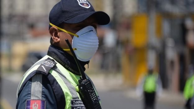 Police with a face mask in Ecuador
