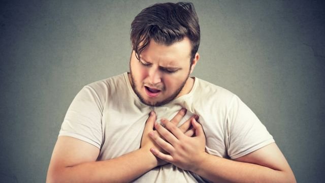 An actor simulating a heart attack