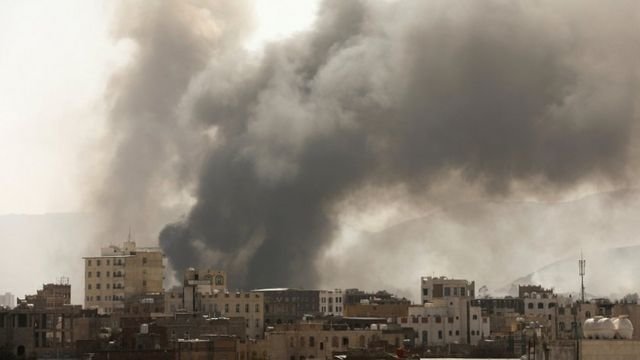 Smoke billows from the site of Saudi-led air strikes in Sanaa, Yemen, on 7 March 2021