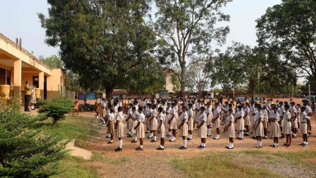 Students assemble on their school compound on the first day of the reopening of schools in Accra, Ghana, on January 18, 2021. - Ghana reopened schools after a 10-month closure to help control the spread of the COVID-19 coronavirus.