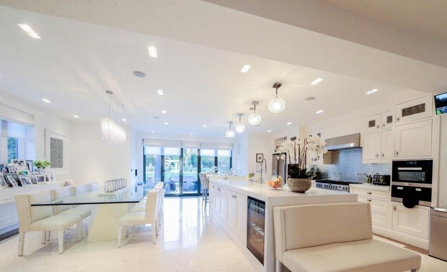 The huge kitchen is classy and modern